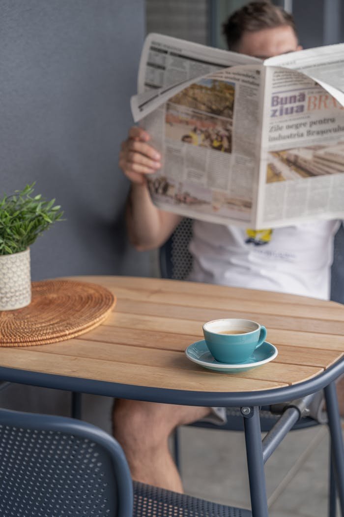 morning-coffee-with-newspaper-on-terrace-34204822